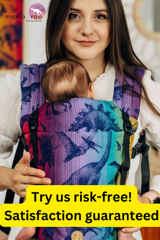 Model wearing baby in Lenny Light SSC in design Jurassic Park New Era, available at Mama & Roo's. Mama & Roo's logo. Text reads, "Try us risk-free! Satisfaction guaranteed"