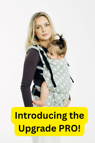 Introducing the Upgrade PRO! Model is wearing her baby in Lenny Upgrade PRO in design Polka Dots - Plop, available for preorder for a limited time at mama-roo.com
