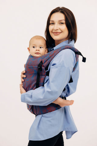 LennyLight Rapunzel Swirl, a blue and red swirl limited edition design soft structured baby carrier for children from birth to 3-4yrs old.