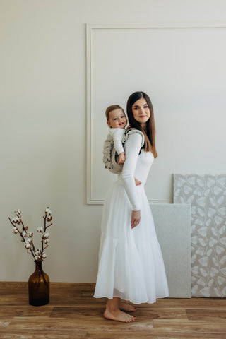 Onbuhimo waist-less wrap conversion baby backpack carrier in limited edition design Airy, in luxury cotton/hemp/lyocell blend. Side view indoors