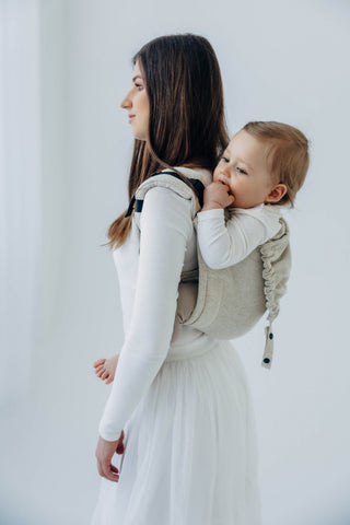 Onbuhimo waist-less wrap conversion baby backpack carrier in limited edition design Airy, in luxury cotton/hemp/lyocell blend. Side view mother looking away white background