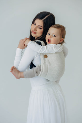 Onbuhimo waist-less wrap conversion baby backpack carrier in limited edition design Airy, in luxury cotton/hemp/lyocell blend. Side angle view mother looking at baby, hood removed