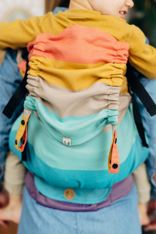 Preschool size wrap conversion soft structured baby backpack carrier (SSC) in cotton woven design Pastels, a beautiful muted stripe pattern in a broken twill weave