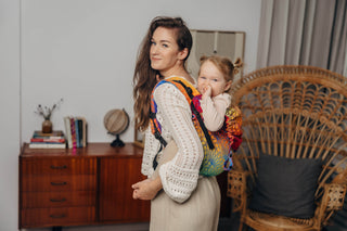 Preschool size wrap conversion waist-less onbuhimo baby backpack carrier for children from 3-7 years old in cotton woven design Rainbow Lotus, a jacquard weave with a bold rainbow gradient under an outlined repeating lotus flower pattern