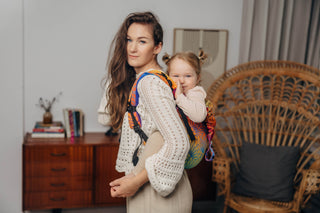 Preschool size wrap conversion waist-less onbuhimo baby backpack carrier for children from 3-7 years old in cotton woven design Rainbow Lotus, a jacquard weave with a bold rainbow gradient under an outlined repeating lotus flower pattern