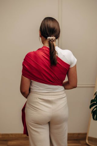 Wrap conversion ring sling baby carrier in cotton woven design Sedona, a red and orange herringbone weave