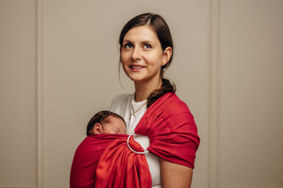 Wrap conversion ring sling baby carrier in cotton woven design Sedona, a red and orange herringbone weave