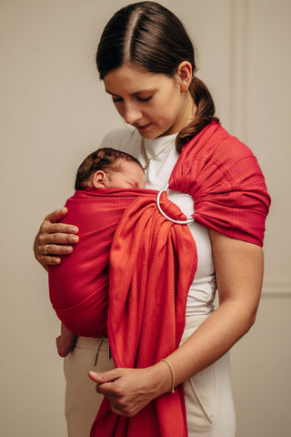 Wrap conversion ring sling baby carrier in cotton woven design Sedona, a red and orange herringbone weave