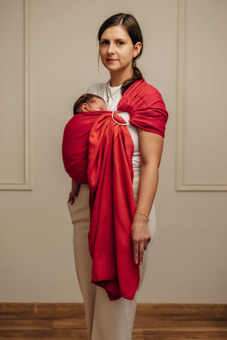 Wrap conversion ring sling baby carrier in cotton woven design Sedona, a red and orange herringbone weave