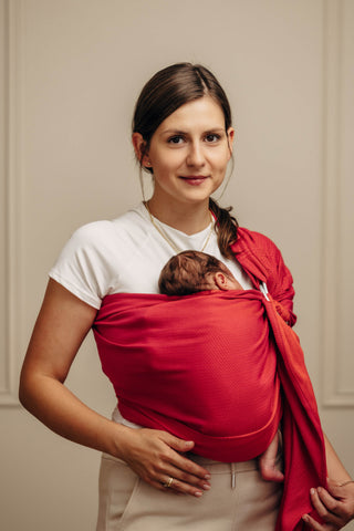 Wrap conversion ring sling baby carrier in cotton woven design Sedona, a red and orange herringbone weave