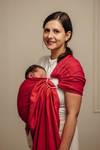 Wrap conversion ring sling baby carrier in cotton woven design Sedona, a red and orange herringbone weave