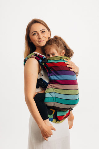 Lenny Lamb preschool carrier in print Carousel of Colors, with horizontal bands of color separated by thin black accent stripes