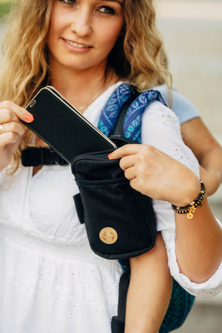 Portable baby carrier pocket for carrier strap