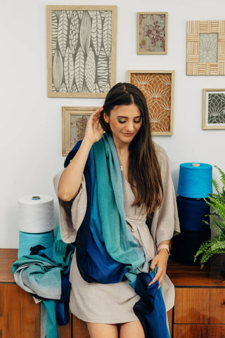 Long woven baby wrap baby carrier  in cotton woven design Airglow, a broken twill weave in an ombre gradient blue to turquoise to grey