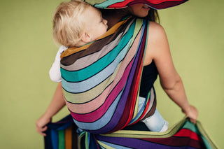 Lenny Lamb Long Woven Wrap - Carousel of Colors - toddler back carry. Wrap has horizontal stripes in rainbow colors with thin black stripes in-between the colors