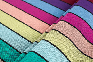 Lenny Lamb Long Woven Wrap - Carousel of Colors - Fabric close up. Wrap has horizontal stripes in rainbow colors with thin black stripes in-between the colors