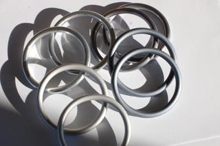 Top left: hand-buffed silver, top right: hand-buffed slate, bottom right: slate, bottom left: silver