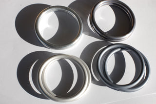 Top left: hand-buffed silver, top right: hand-buffed slate, bottom right: slate, bottom left: silver